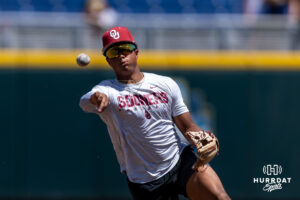 Oklahoma Sooner throws the ball to first during the CWS media day on Thursday, June 11, 2026, in Omaha, Neb. Photo by John S. Peterson.