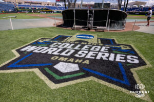 Ground crew finished the CWS logo during the CWS media day on Thursday, June 11, 2026, in Omaha, Neb. Photo by John S. Peterson.