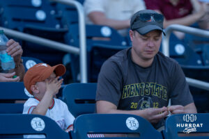A father and son sit together during the CWS media day on June 11, 2026, in Omaha, Nebraska. Photo by Brandon Tiedemann.