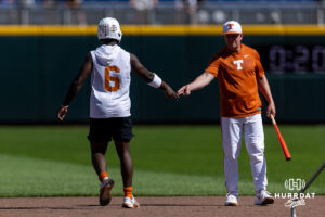 Texas Longhorn 2026 head coach Jim Schlossnagle and Anthony Pack Jr. give each other two during the CWS media day on Thursday, June 11, 2026, in Omaha, Neb. Photo by John S. Peterson.