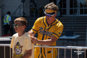 Savannah Banana Jackson Olson (8) signs an autograph during a Banana ball game on June 13, 2026, in Omaha, Nebraska. Photo by Brandon Tiedemann.