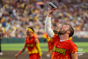 Firefighters Johnny Hummel (95) celebrates a win during a Banana ball game on June 13, 2026, in Omaha, Nebraska. Photo by Brandon Tiedemann.