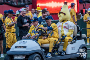 Former Husker head coach Tom Osborne rides in the cart during a Banana ball game on June 13, 2026, in Omaha, Nebraska. Photo by Brandon Tiedemann.