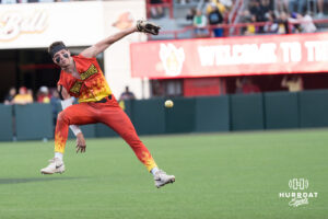 Firefighters South Trimble (8) throws the ball between his leg during a Banana ball game on June 13, 2026, in Omaha, Nebraska. Photo by Brandon Tiedemann.