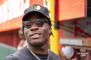 Kansas City Chief running back Emmett Johnson smiles during a Banana ball game on June 13, 2026, in Omaha, Nebraska. Photo by Brandon Tiedemann.