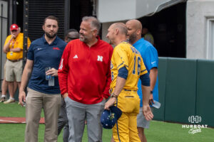 Savannah Banana Adam Virant (16) talks with Husker football head coach Matt Rhule during a Banana ball game on June 13, 2026, in Omaha, Nebraska. Photo by Brandon Tiedemann.