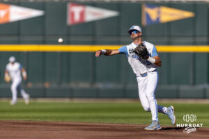 North Carolina Tar Heel 2026 infielder Gavin Gallaher (5) throws the ball to first for an out against the West Virginia Mountaineers in the first inning during the College World Series baseball tournament on Sunday, June 14, 2026, in Omaha, Neb. Photo by John S. Peterson.