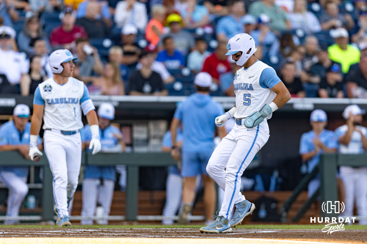North Carolina Tar Heel Gavin Gallaher (5) is walked in for a run against the West Virginia Mountaineers in the first inning during the College World Series baseball tournament on Sunday, June 14, 2026, in Omaha, Neb. Photo by John S. Peterson.