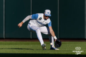North Carolina Tar Heel 2026 infielder Owen Hull (8) scoops up the ball against the West Virginia Mountaineers during the College World Series baseball tournament on Sunday, June 14, 2026, in Omaha, Neb. Photo by John S. Peterson.