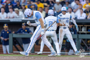 North Carolina Tar Heel Owen Hull (8) give a fist pump celebrating Jake Schaffner's run in the seventh during the College World Series baseball tournament on Sunday, June 14, 2026, in Omaha, Neb. Photo by John S. Peterson.