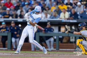 North Carolina Tar Heel Owen Hull (8) singles in the seventh driving in a run against the West Virginia Mountaineers during the College World Series baseball tournament on Sunday, June 14, 2026, in Omaha, Neb. Photo by John S. Peterson.