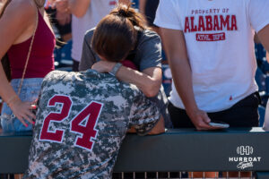 Alabamas Tate Robertson (24) hugs his mom during a CWS game on June 15, 2026, in Omaha, Nebraska. Photo by Brandon Tiedemann.