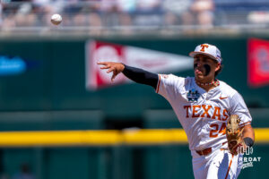 Texas Longhorns Adrian Rodriguez (24) throws to first base during a CWS game on June 15, 2026, in Omaha, Nebraska. Photo by Brandon Tiedemann.