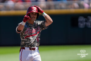 Alabamas Brennan Holt (4) points to the dugout during a CWS game on June 15, 2026, in Omaha, Nebraska. Photo by Brandon Tiedemann.