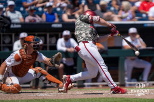 Alabamas Brady Neal (10) hits during a CWS game on June 15, 2026, in Omaha, Nebraska. Photo by Brandon Tiedemann.