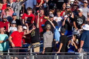 A young CWS fan catches the home run ball from Oklahoma Sooner catcher Brendan Brock (10) in the fourth inning against the Georgia Bulldogs during the College World Series baseball tournament on Monday, June 15, 2026, in Omaha, Neb. Photo by John S. Peterson.