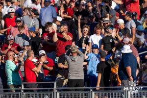 A young CWS fan catches the home run ball from Oklahoma Sooner catcher Brendan Brock (10) in the fourth inning against the Georgia Bulldogs during the College World Series baseball tournament on Monday, June 15, 2026, in Omaha, Neb. Photo by John S. Peterson.