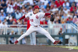 Oklahoma Sooner pitcher Jackson Cleveland (49) throws a pitch against the Georgia Bulldogs in the eighth inning during the College World Series baseball tournament on Monday, June 15, 2026, in Omaha, Neb. Photo by John S. Peterson.