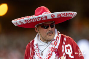 The Sooner sombero fan watching the game action against the Georgia Bulldogs during the College World Series baseball tournament on Monday, June 15, 2026, in Omaha, Neb. Photo by John S. Peterson.