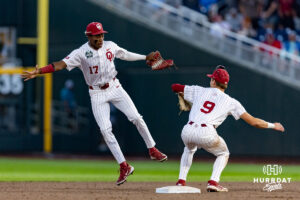 Oklahoma Sooner Dasan Harris (17) and Camden Johnson (9) celebrate the win over the Georgia Bulldogs during the College World Series baseball tournament on Monday, June 15, 2026, in Omaha, Neb. Photo by John S. Peterson.