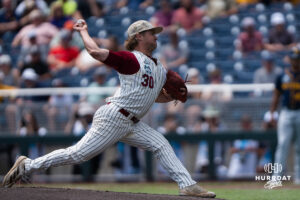 Troy Trojans Cooper Ellingworth (30) pitches during a CWS game on June 16, 2026, in Omaha, Nebraska. Photo by Brandon Tiedemann.