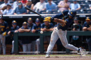 West Virginia Mountaineers Armani Guzman (5) hits during a CWS game on June 16, 2026, in Omaha, Nebraska. Photo by Brandon Tiedemann.