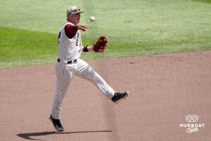 Troy Trojans Aaron Piasecki (2) throws to first base during a CWS game on June 16, 2026, in Omaha, Nebraska. Photo by Brandon Tiedemann.