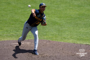 West Virginia Mountaineers Dawson Montesa (31) pitches during a CWS game on June 16, 2026, in Omaha, Nebraska. Photo by Brandon Tiedemann.