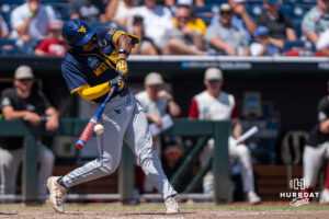 West Virginia Mountaineers Sean Smith (11) hits during a CWS game on June 16, 2026, in Omaha, Nebraska. Photo by Brandon Tiedemann.