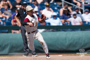 Troy Trojans Josh Pyne (32) throws to second base during a CWS game on June 16, 2026, in Omaha, Nebraska. Photo by Brandon Tiedemann.