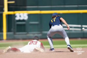 Troy Trojans Houston Markham (23) steals second base during a CWS game on June 16, 2026, in Omaha, Nebraska. Photo by Brandon Tiedemann.