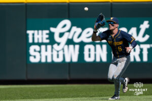 West Virginia Mountaineers Paul Schoenfeld (6) catches a fly ball during a CWS game on June 16, 2026, in Omaha, Nebraska. Photo by Brandon Tiedemann.