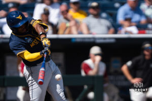 West Virginia Mountaineers Sean Smith (11) hits during a CWS game on June 16, 2026, in Omaha, Nebraska. Photo by Brandon Tiedemann.