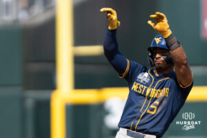 West Virginia Mountaineers Armani Guzman (5) celebrates a double during a CWS game on June 16, 2026, in Omaha, Nebraska. Photo by Brandon Tiedemann.