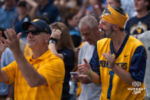 A West Virginia Mountaineers fan cheers after a CWS game on June 16, 2026, in Omaha, Nebraska. Photo by Brandon Tiedemann.