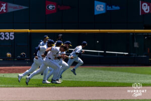 West Virginia Mountaineers warm up against the North Carolina Tar Heels during the College World Series baseball tournament on Wednesday, June 17, 2026, in Omaha, Neb. Photo by John S. Peterson.