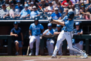 North Carolina Tar Heels Owen Hull (8) hits the ball in the first inning during a CWS game on June 17, 2026, in Omaha, Nebraska. Photo by Brandon Tiedemann.