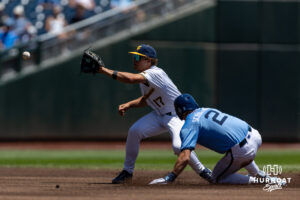 orth Carolina Tar Heel Jake Schaffner (2) slides at second base against the West Virginia Mountaineers in the first inning during the College World Series baseball tournament on Wednesday, June 17, 2026, in Omaha, Neb. Photo by John S. Peterson.