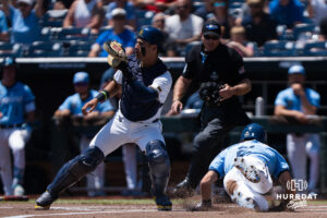 North Carolina Tar Heels Jake Schaffner (2) slides into home base in the first inning during a CWS game on June 17, 2026, in Omaha, Nebraska. Photo by Brandon Tiedemann.