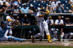 West Virginia Mountaineer Matthew Graveline (0) hits a one run single in the first inning against the North Carolina Tar Heels during the College World Series baseball tournament on Wednesday, June 17, 2026, in Omaha, Neb. Photo by John S. Peterson.