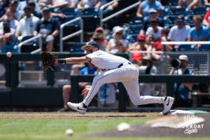 West Virginia Mountaineers Brodie Kresser (12) reaches for a catch in the second inning during a CWS game on June 17, 2026, in Omaha, Nebraska. Photo by Brandon Tiedemann.
