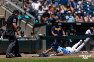 North Carolina Tar Heel 2026 infielder Jake Schaffner (2) slides home for a run against the West Virginia Mountaineers in the third inning during the College World Series baseball tournament on Wednesday, June 17, 2026, in Omaha, Neb. Photo by John S. Peterson.