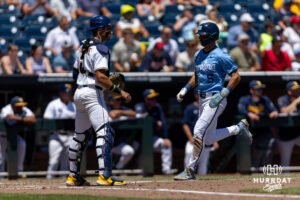 North Carolina Tar Heel 2026 infielder Gavin Gallaher (5) scores a run on a two-run triple in the third inning against the West Virginia Mountaineers during the College World Series baseball tournament on Wednesday, June 17, 2026, in Omaha, Neb. Photo by John S. Peterson.
