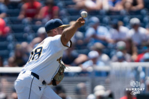 West Virginia Mountaineers Ian Korn (18) pitches in the third inning during a CWS game on June 17, 2026, in Omaha, Nebraska. Photo by Brandon Tiedemann.