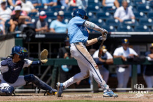 North Carolina Tar Heel Owen Hull (8) hits a two-run double in the fourth inning against the West Virginia Mountaineers drives in during the College World Series baseball tournament on Wednesday, June 17, 2026, in Omaha, Neb. Photo by John S. Peterson.