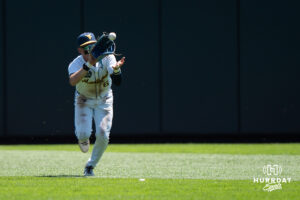 West Virginia Mountaineers Paul Schoenfeld (6) catches a fly ball in the third inning during a CWS game on June 17, 2026, in Omaha, Nebraska. Photo by Brandon Tiedemann.