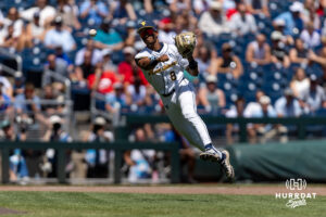 West Virginia Mountaineer infielder Tyrus Hall (8) throws to first for an out against the North Carolina Tar Heels in the fifth inning during the College World Series baseball tournament on Wednesday, June 17, 2026, in Omaha, Neb. Photo by John S. Peterson.