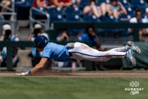 North Carolina Tar Heel infielder Owen Hull (8) slides to third on a triple in the sixth against the West Virginia Mountaineers during the College World Series baseball tournament on Wednesday, June 17, 2026, in Omaha, Neb. Photo by John S. Peterson.