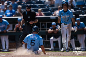 North Carolina Tar Heels Macon Winslow (6) slides into home in the seventh inning during a CWS game on June 17, 2026, in Omaha, Nebraska. Photo by Brandon Tiedemann.