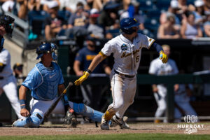 West Virginia Mountaineer Paul Schoenfeld (6) hits a one-run single in the seventh during the College World Series baseball tournament on Wednesday, June 17, 2026, in Omaha, Neb. Photo by John S. Peterson.